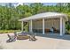 Outdoor pavilion with a fire pit and comfortable seating, creating a cozy space for gatherings at 2815 Colonel Harrison Dr, Johns Island, SC 29455