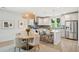 Beautiful eat-in kitchen features stainless steel appliances, light gray cabinets and a center island at 2815 Colonel Harrison Dr, Johns Island, SC 29455