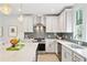 Stylish kitchen with stainless steel appliances, white cabinetry, and a large center island with barstool seating at 2815 Colonel Harrison Dr, Johns Island, SC 29455