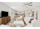 Cozy living room features comfortable white sofas, bright windows and opens to a modern kitchen at 2815 Colonel Harrison Dr, Johns Island, SC 29455