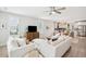 Bright, open living area features comfortable seating, light wood floors and connects to an eat-in kitchen at 2815 Colonel Harrison Dr, Johns Island, SC 29455