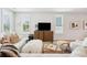 Comfortable living room features a large TV, bright windows, and cozy seating at 2815 Colonel Harrison Dr, Johns Island, SC 29455