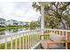 Scenic view from the covered patio overlooking a tranquil pond and neighboring houses at 2815 Colonel Harrison Dr, Johns Island, SC 29455