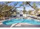 Community swimming pool surrounded by sun loungers and palm trees, offering a relaxing retreat at 2815 Colonel Harrison Dr, Johns Island, SC 29455