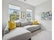 Cozy sitting room with a comfortable sectional sofa, artwork, and natural light from the windows at 2815 Colonel Harrison Dr, Johns Island, SC 29455