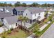 Aerial view of a home with a fenced backyard, a patio, palm trees, and a detached garage at 2866 Sugarberry Ln, Johns Island, SC 29455