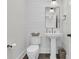 Elegant powder room featuring stylish fixtures, a pedestal sink, and a clean design at 2866 Sugarberry Ln, Johns Island, SC 29455