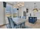 Open concept eat-in kitchen and dining room combo, featuring elegant pendant lights at 2866 Sugarberry Ln, Johns Island, SC 29455