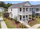 Charming two-story home with a inviting front porch and well-manicured landscaping at 2866 Sugarberry Ln, Johns Island, SC 29455