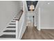 Bright foyer with hardwood floors, staircase, and decorative ceiling at 2866 Sugarberry Ln, Johns Island, SC 29455