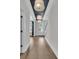 Spacious foyer with hardwood floors and eye-catching pendant lighting at 2866 Sugarberry Ln, Johns Island, SC 29455