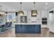 Bright kitchen with stainless steel appliances, large island, and adjacent dining area at 2866 Sugarberry Ln, Johns Island, SC 29455