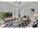 Cozy living room with comfortable seating, a modern rug, and plenty of natural light at 2866 Sugarberry Ln, Johns Island, SC 29455
