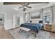 Spacious primary bedroom with tray ceilings, a seating area, and refined decor at 2866 Sugarberry Ln, Johns Island, SC 29455