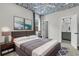 Beautiful bedroom with patterned ceiling, en-suite bath, and luxurious gray and white accents at 2866 Sugarberry Ln, Johns Island, SC 29455