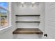 Well-lit office nook with custom shelving and desk, perfect for a home workspace at 2866 Sugarberry Ln, Johns Island, SC 29455