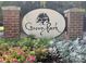 The Grove Park entrance sign is surrounded by colorful floral arrangements at 308 Pickering Ln, Charleston, SC 29414