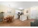 Bright kitchen with white cabinets, stainless steel appliances, and eat in dining area at 308 Pickering Ln, Charleston, SC 29414