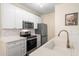 Efficient kitchen with stainless appliances, white cabinets, and bright, stylish finishes at 308 Pickering Ln, Charleston, SC 29414