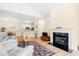 Open living room and kitchen area featuring fireplace and dining table at 308 Pickering Ln, Charleston, SC 29414