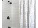 Close up of shower featuring white subway tile and matte black shower head and handle at 3105 Matipan Ave, North Charleston, SC 29405