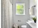 Clean bathroom featuring white vanity, neutral paint, and natural lighting at 3105 Matipan Ave, North Charleston, SC 29405