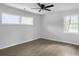 Bright bedroom featuring two windows, a ceiling fan, and attractive flooring at 3105 Matipan Ave, North Charleston, SC 29405