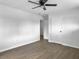 Bedroom showcasing dark, modern flooring, a ceiling fan, and closet space at 3105 Matipan Ave, North Charleston, SC 29405