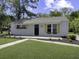 Charming one-story home featuring a well-manicured lawn and flower boxes under the windows at 3105 Matipan Ave, North Charleston, SC 29405