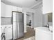 Modern kitchen boasts new stainless steel appliances, white cabinetry, and sleek countertops at 3105 Matipan Ave, North Charleston, SC 29405