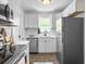 Updated kitchen featuring stainless steel appliances and bright white cabinets at 3105 Matipan Ave, North Charleston, SC 29405