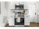 Charming kitchen features stainless steel appliances and bright white cabinets at 3105 Matipan Ave, North Charleston, SC 29405