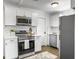 Stylish kitchen featuring white cabinets, stainless steel appliances, subway tile backsplash, and modern finishes at 3105 Matipan Ave, North Charleston, SC 29405