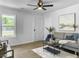 Inviting living room with wood floors, modern decor, and large windows offering ample natural light at 3105 Matipan Ave, North Charleston, SC 29405