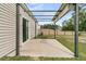 A back patio area with a pergola and concrete slab, perfect for outdoor seating and entertainment at 313 Squire Pope Rd, Summerville, SC 29486