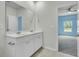 Bathroom features a double sink vanity with large mirror and view into the bedroom at 313 Squire Pope Rd, Summerville, SC 29486