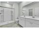 Bright bathroom features a double vanity, mirror, and white walk-in shower at 313 Squire Pope Rd, Summerville, SC 29486