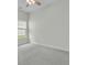 Open bedroom space with natural light streaming through the window, and carpet flooring at 313 Squire Pope Rd, Summerville, SC 29486
