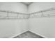 Empty walk-in closet with wire shelving and carpeted flooring, providing ample storage space at 313 Squire Pope Rd, Summerville, SC 29486