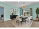 Elegant dining room features modern lighting, a chic table set, and sliding door access at 313 Squire Pope Rd, Summerville, SC 29486