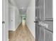 Inviting hallway with wood flooring, leading to bright and airy living spaces at 313 Squire Pope Rd, Summerville, SC 29486