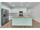 Bright kitchen with stainless steel appliances, granite countertops, and a spacious island at 313 Squire Pope Rd, Summerville, SC 29486
