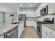 Modern kitchen with stainless steel appliances, granite countertops, and ample cabinet space at 313 Squire Pope Rd, Summerville, SC 29486