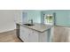 Spacious kitchen island with stainless steel appliances and an adjacent dining area at 313 Squire Pope Rd, Summerville, SC 29486