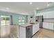 Gourmet kitchen with stainless steel appliances and a large island perfect for entertaining at 313 Squire Pope Rd, Summerville, SC 29486