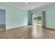 Airy living room showcasing sleek flooring, a sliding glass door, and neutral decor at 313 Squire Pope Rd, Summerville, SC 29486