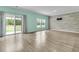 The light-filled living room offers a sliding door that opens to a beautiful backyard at 313 Squire Pope Rd, Summerville, SC 29486