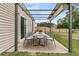 Outdoor patio features a dining table with seating, perfect for al fresco dining and entertaining at 313 Squire Pope Rd, Summerville, SC 29486