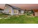 Spacious backyard with a playset, patio, and solar panels on the roof at 3431 Great Egret Dr, Johns Island, SC 29455