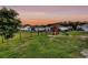 Large backyard with a playset and black metal fence at 3431 Great Egret Dr, Johns Island, SC 29455